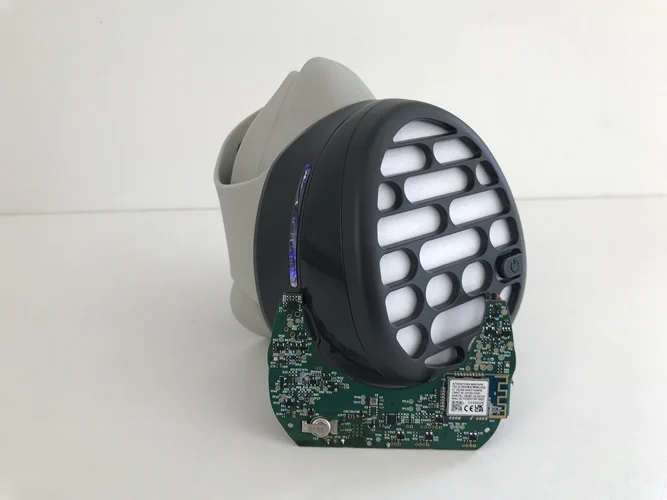 sitting doughnut table donut remote pair board laying control holding necklace blue air phone